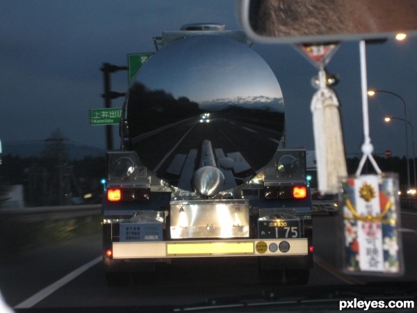 Behind the mirror-like truck